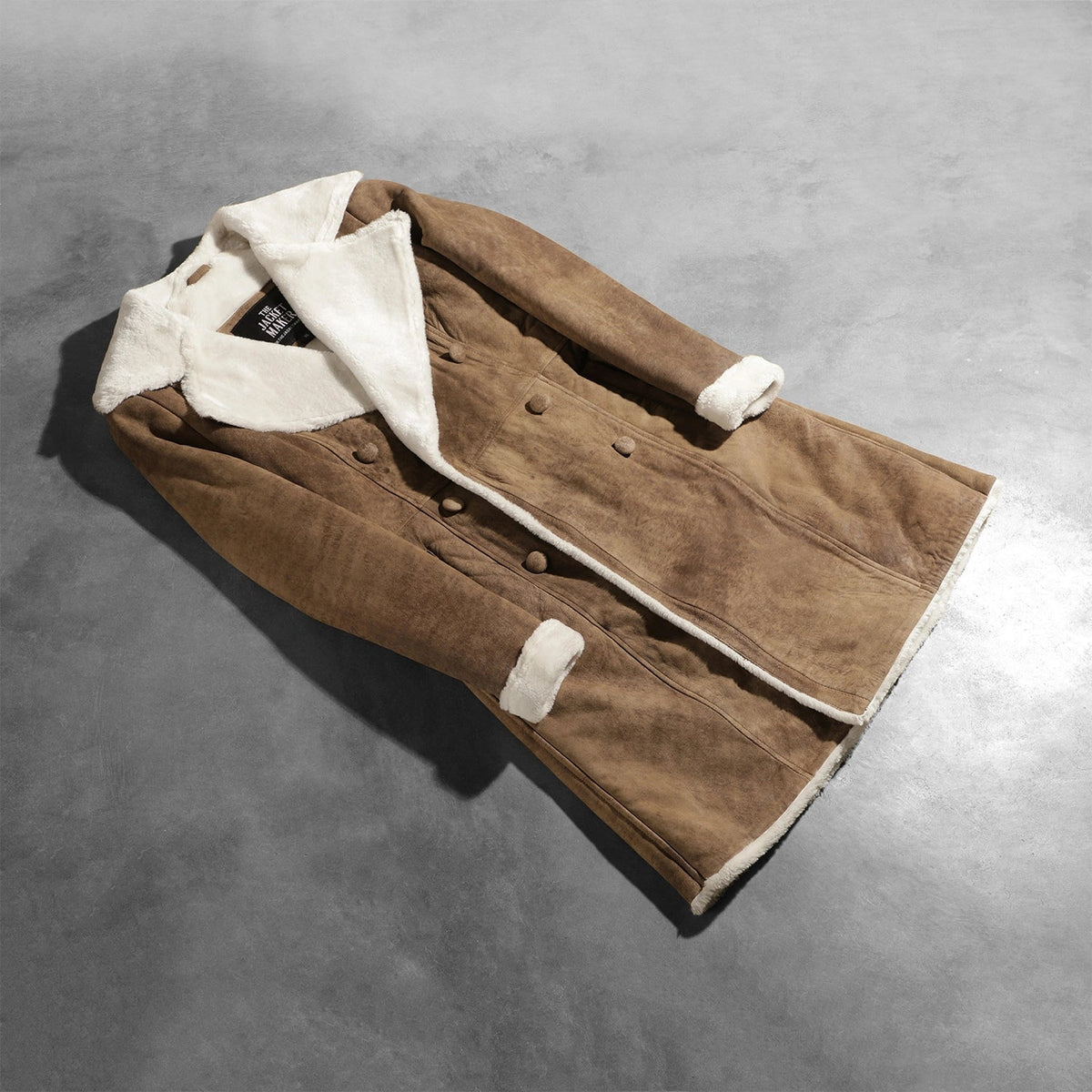Open Hem &amp; Hem Craftsmanship Construction Detail on Women's Amie Distressed Brown Double Breasted Shearling Coat