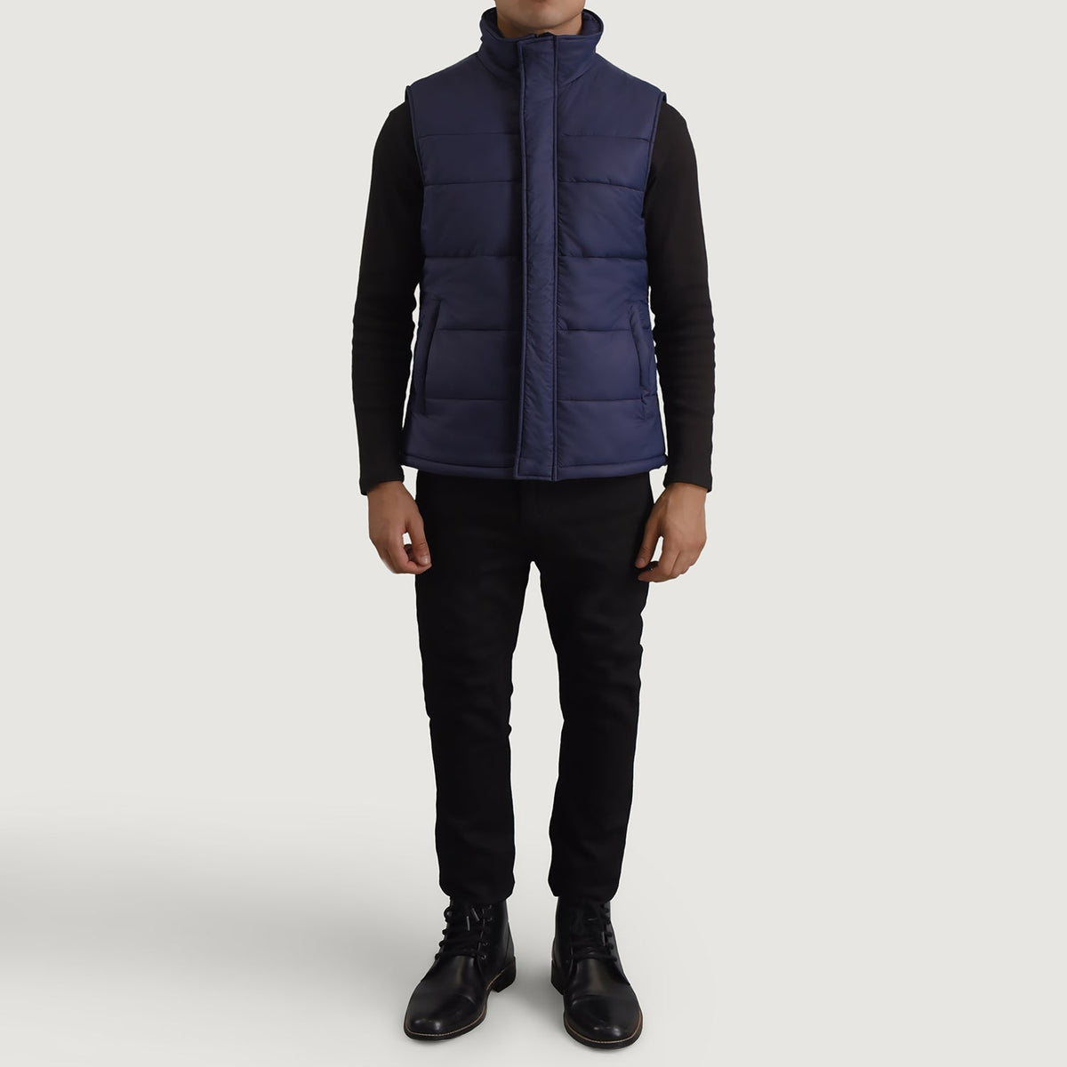Bryan Azul Puffer Vest para Hombre - Vista de perfil lateral con corte ergonómico de manga