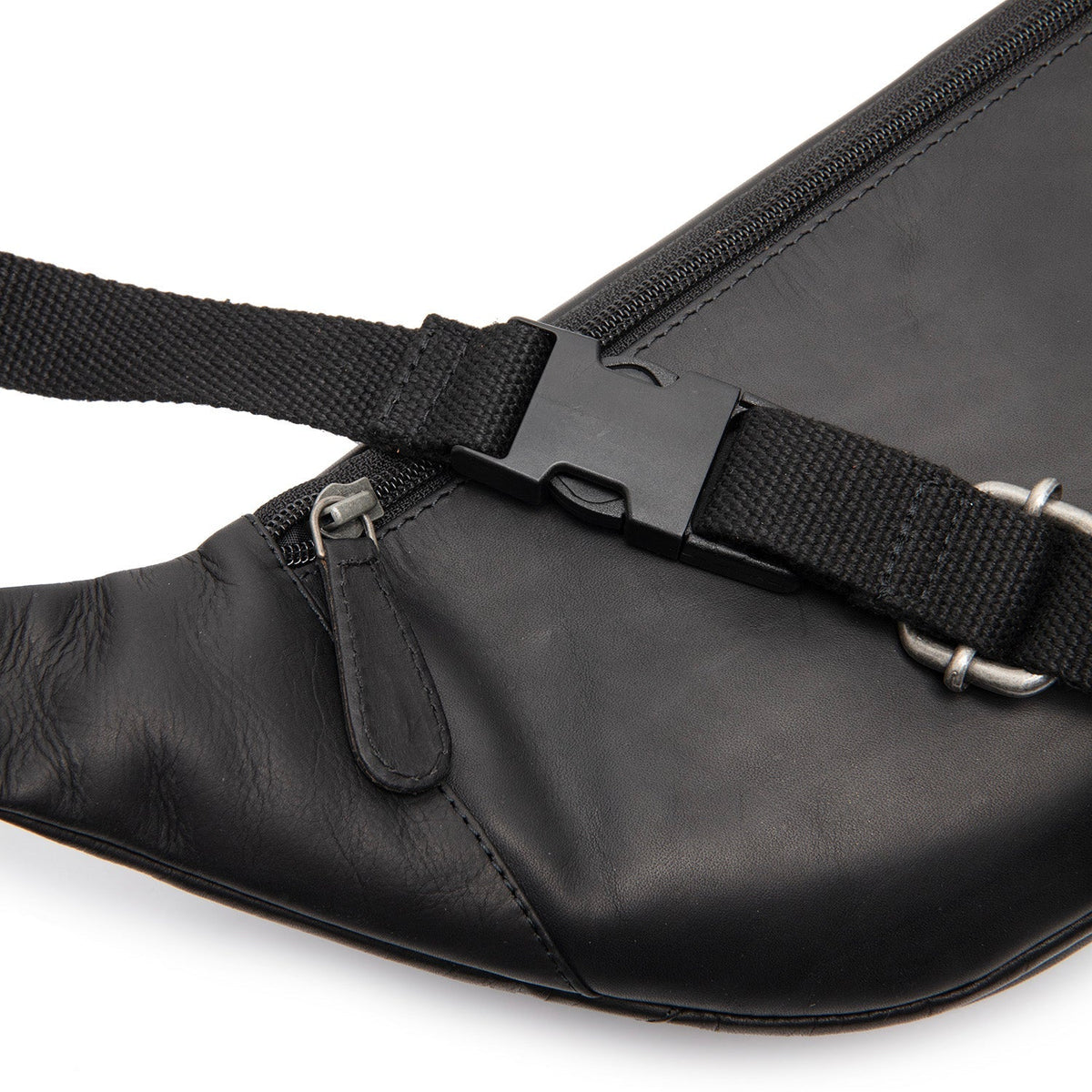 
Solid Antique Brass Hardware & Heavy-Duty Dual Zipper Detail on Vernio Riñonera de cuero flor