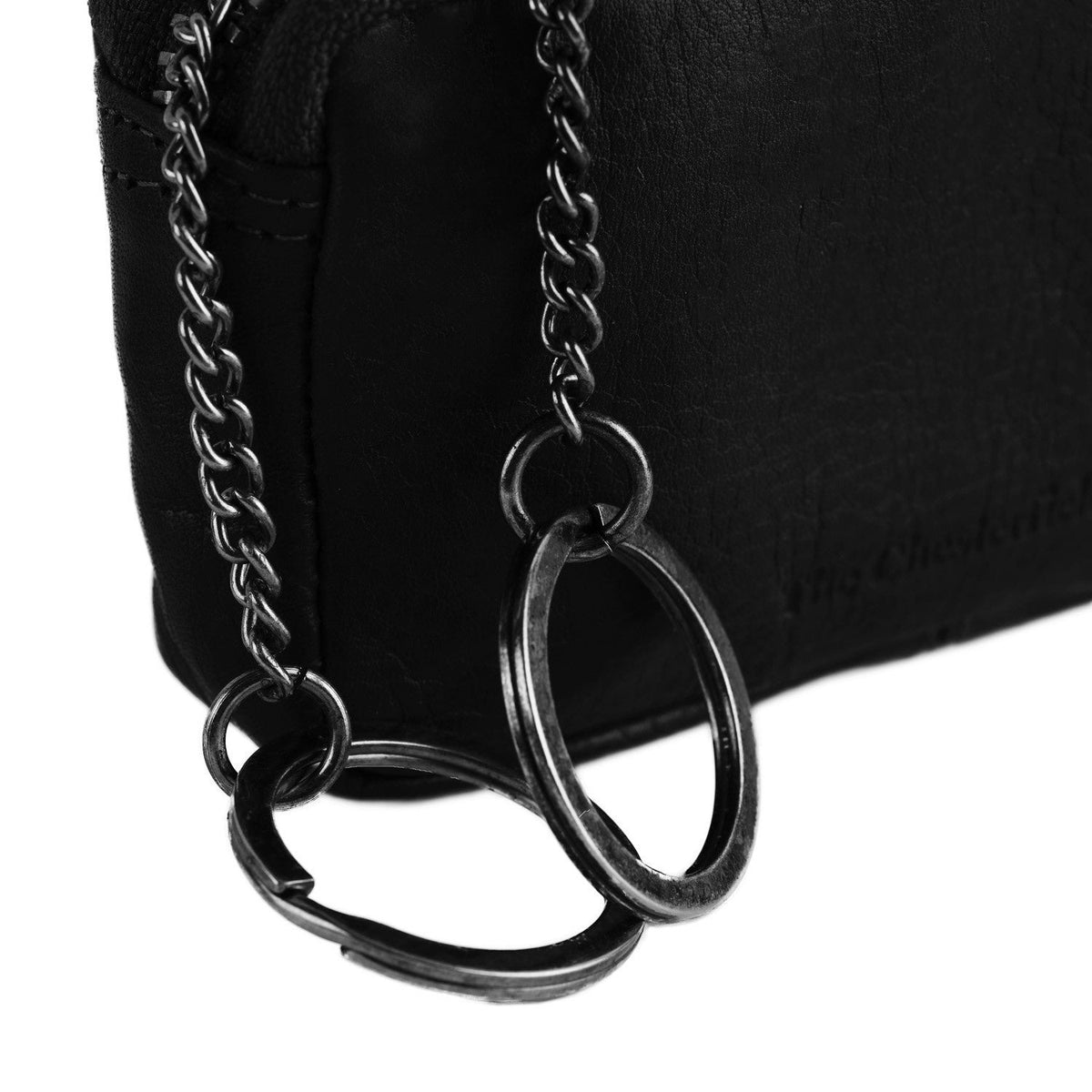 Corey Full-Grain Leather Key Case para Mujer - Vista de perfil lateral con corte ergonómico de manga