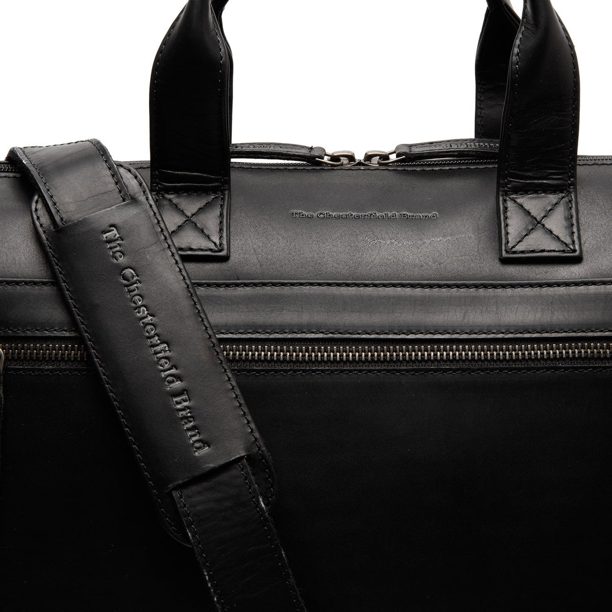 
Solid Antique Brass Hardware & Heavy-Duty Dual Zipper Detail on Levanto Maletín para portátil de cuero flor