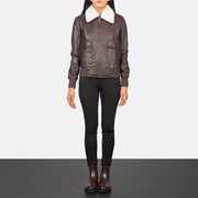 Women's Stella G-1 Maroon Leather Bomber Jacket - Vista de perfil lateral con corte ergonómico de manga